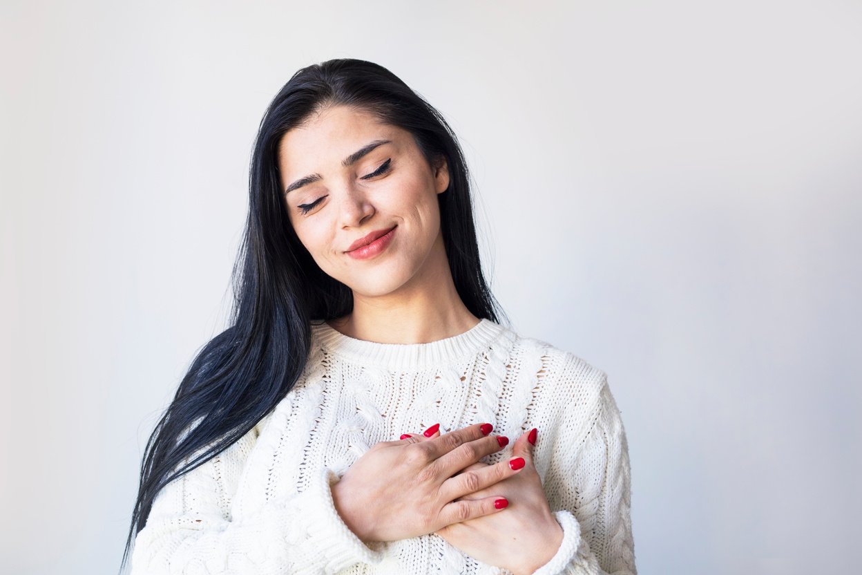 Self love, self acceptance, happiness concept. Woman hugging herself